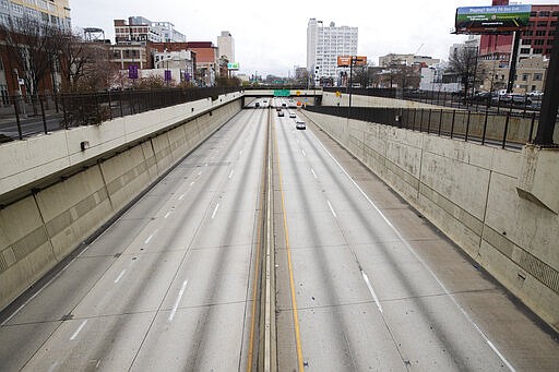 Few people travel on Interstate 676 in Philadelphia, Wednesday, March 25, 2020. Philadelphia Mayor Jim Kenney is issuing a stay-at-home order to the nation's sixth most-populated city to keep its 1.6 million people from leaving home, due to the coronavirus except to get food, seek medical attention, exercise outdoors, go to a job classified as essential or other errands that involve personal and public safety. (AP Photo/Matt Rourke)