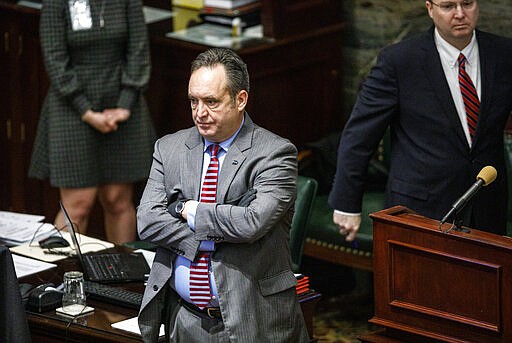 Senate Majority Leader Jake Corman, R-Centre County wears black gloves during a senate session, Wednesday, March 25, 2020, in Harrisburg, Pa. The state Senate is holding a session to vote on changing the primary election date, among other measures. The Senate session is the first in state history where members can meet online and vote remotely due to the coronavirus pandemic. (Dan Gleiter/The Patriot-News via AP)