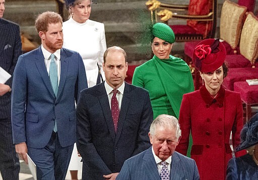 FILE - In this file photo dated Monday March 9, 2020, members of Britain's royal family, with Prince Charles in foreground, followed by Prince William with Kate Duchess of Cambridge, and Prince Harry with Meghan Duchess of Sussex, as they leave the annual Commonwealth Service at Westminster Abbey in London. Britain's Queen Elizabeth II and other members of the royal family along with various government leaders and guests attended the annual Commonwealth Day service, the largest annual inter-faith gathering in the United Kingdom.  The prince&#146;s Clarence House office reported on Wednesday, March 25, 2020 that the 71-year-old Prince Charles is showing mild symptoms of COVID-19 and is self-isolating at a royal estate in Scotland, also saying his wife Camilla has tested negative. (Phil Harris / FILE via AP)