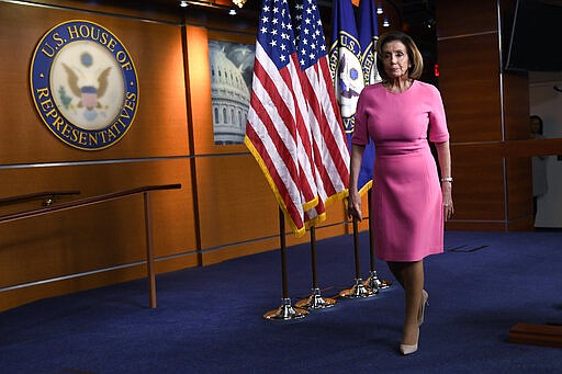 House Speaker Nancy Pelosi of Calif., walks off of the stage after speaking during a news conference on Capitol Hill in Washington, Thursday, March 26, 2020. (AP Photo/Susan Walsh)