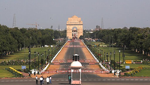 Rajpath, India's ceremonial boulevard is seen during a lockdown to control the new virus spread, in New Delhi, India, Wednesday, March 25, 2020. The world's largest democracy went under the world's biggest lockdown Wednesday, with India's 1.3 billion people ordered to stay home in a bid to stop the coronavirus pandemic from spreading and overwhelming its fragile health care system as it has done elsewhere. The new coronavirus causes mild or moderate symptoms for most people, but for some, especially older adults and people with existing health problems, it can cause more severe illness or death. (AP Photo/Manish Swarup)