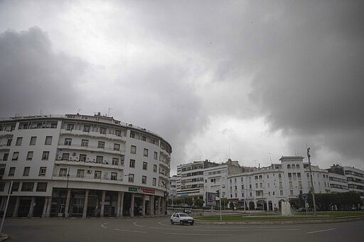 Cars drive on a main avenue on the day when Morocco declared a health emergency and further limited movement to prevent the spread of the coronavirus, in Rabat, Morocco, Friday, March 20, 2020. For most people, the new coronavirus causes only mild or moderate symptoms, such as fever and cough. For some, especially older adults and people with existing health problems, it can cause more severe illness, including pneumonia. (AP Photo/Mosa'ab Elshamy)