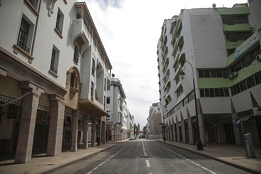 An empty street in downtown Rabat is seen following the announcement of a health state of emergency and members of the public ordered to a home confinement, in Rabat, Morocco, Sunday, March 22, 2020. For some people the COVID-19 coronavirus causes mild or moderate symptoms, but for some it can cause severe illness including pneumonia.(AP Photo/Mosa'ab Elshamy)