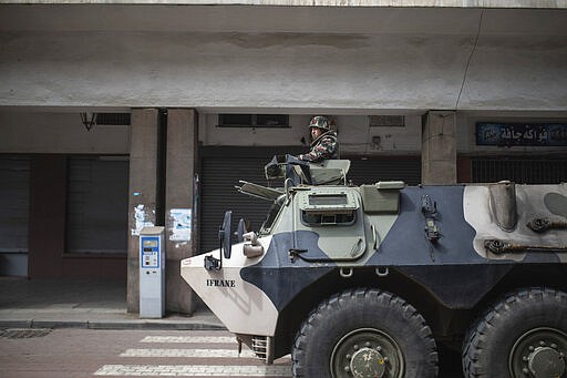 A military vehicle patrols the streets to enforce a health state of emergency and home confinement orders, in Rabat, Morocco, Sunday, March 22, 2020. For some people the COVID-19 coronavirus causes mild or moderate symptoms, but for some it can cause severe illness including pneumonia. (AP Photo/Mosa'ab Elshamy)