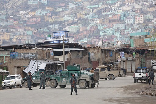 Afghan police arrive at the site of an attack in Kabul, Afghanistan, Wednesday, March 25, 2020. Gunmen stormed a religious gathering of Afghanistan's minority Sikhs in their place of worship in the heart of the Afghan capital's old city on Wednesday, a minority Sikh parliamentarian said. (AP Photo/Rahmat Gul)