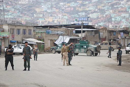 Afghan police arrive at the site of an attack in Kabul, Afghanistan, Wednesday, March 25, 2020. Gunmen stormed a religious gathering of Afghanistan's minority Sikhs in their place of worship in the heart of the Afghan capital's old city on Wednesday, a minority Sikh parliamentarian said. (AP Photo/Rahmat Gul)