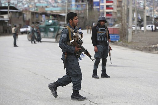 Afghan personnel arrive at the site of an attack in Kabul, Afghanistan, Wednesday, March 25, 2020. Gunmen stormed a religious gathering of Afghanistan's minority Sikhs in their place of worship in the heart of the Afghan capital's old city on Wednesday, a minority Sikh parliamentarian said. (AP Photo/Rahmat Gul)