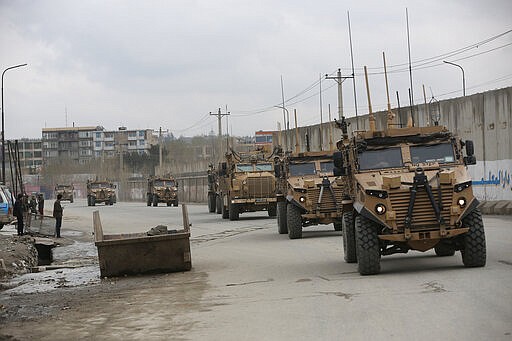 British soldiers with NATO-led Resolute Support Mission forces arrive at the site of an attack in Kabul, Afghanistan, Wednesday, March 25, 2020. Gunmen stormed a religious gathering of Afghanistan's minority Sikhs in their place of worship in the heart of the Afghan capital's old city on Wednesday, a minority Sikh parliamentarian said. (AP Photo/Rahmat Gul)