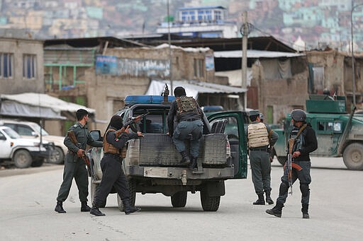 Afghan personnel arrive at the site of an attack in Kabul, Afghanistan, Wednesday, March 25, 2020. Gunmen stormed a religious gathering of Afghanistan's minority Sikhs in their place of worship in the heart of the Afghan capital's old city on Wednesday, a minority Sikh parliamentarian said. (AP Photo/Rahmat Gul)