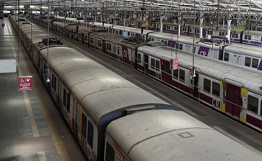 Trains stand parked at Chhatrapati Shivaji Maharaj Terminus after the country halted its railway network in Mumbai, India, Tuesday, March 24, 2020. India's colossal passenger railway system has come to a halt as officials take emergency measures to keep the coronavirus pandemic from spreading in the country of 1.3 billion. The railway system is often described as India's lifeline, transporting 23 million people across the vast subcontinent each day, some 8.4 billion passengers each year. (AP Photo/Rajanish Kakade)