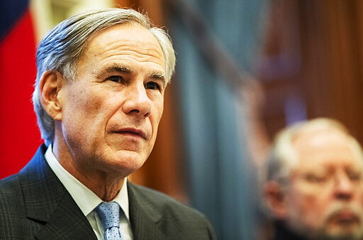 Governor Greg Abbott, issued an executive order for a disaster proclamation ordering a mandatory 14-day quarantine for air travelers from coronavirus hot spots Thursday, March 26, 2020. (Ricardo B. Brazziell/Austin American-Statesman via AP)