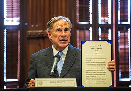 Governor Greg Abbott, issued an executive order for a disaster proclamation ordering a mandatory 14-day quarantine for air travelers from coronavirus hot spots Thursday, March 26, 2020. (Ricardo B. Brazziell/Austin American-Statesman via AP)