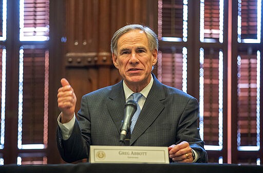 Governor Greg Abbott, issued an executive order for a disaster proclamation ordering a mandatory 14-day quarantine for air travelers from coronavirus hot spots Thursday, March 26, 2020. (Ricardo B. Brazziell/Austin American-Statesman via AP)