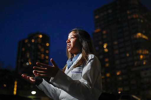 CORRECTS SPELLING TO DOOBAY INSTEAD OF DOOBEY ON SECOND REFERENCE  - Kamini Doobay, an Emergency Medicine Resident physician at NYU Langone Medical Center and Bellevue Hospital, talks during an interview about her experiences treating COVID-19 patients, Thursday, March 26, 2020, in New York. As an emergency medicine physician in New York City, Dr. Doobay has always known that death is part of the territory in trying to care for the city's sickest. But it hasn't been like this _ patients stricken with coronavirus, on ventilators, and no visitors allowed because of strict protocols to prevent its spread. (AP Photo/John Minchillo)