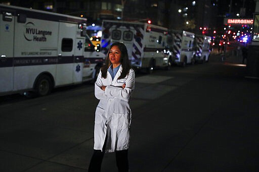 CORRECTS SPELLING TO DOOBAY INSTEAD OF DOOBEY ON SECOND REFERENCE - Kamini Doobay, an Emergency Medicine Resident physician at NYU Langone Medical Center and Bellevue Hospital, talks during an interview about her experiences treating COVID-19 patients, Thursday, March 26, 2020, in New York. As an emergency medicine physician in New York City, Dr. Doobay has always known that death is part of the territory in trying to care for the city's sickest. But it hasn't been like this _ patients stricken with coronavirus, on ventilators, and no visitors allowed because of strict protocols to prevent its spread. (AP Photo/John Minchillo)