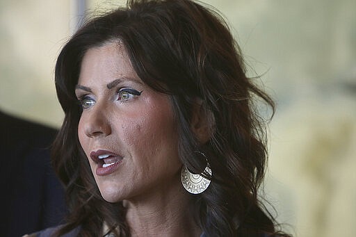 FILE - In this Wednesday, March 18, 2020, file photo, South Dakota Gov. Kristi Noem updates the media on the COVID-19 pandemic during a news conference, at Monument Health in Rapid City, S.D. Noem issued an executive order, Monday, March 23, 2020, recommending that businesses limit gatherings and hospitals postpone elective procedures. (Jeff Easton/Rapid City Journal via AP, File)