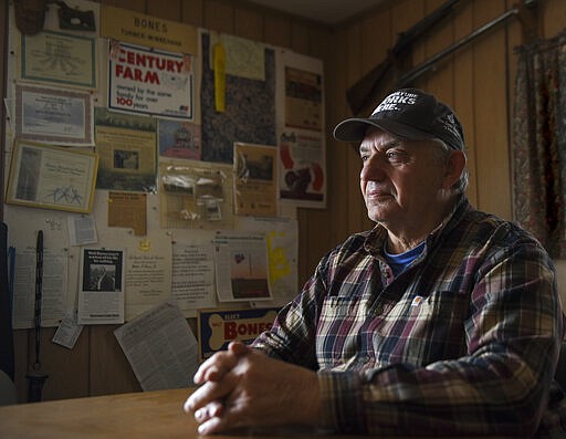 Walt Bones, a fourth generation cattle rancher of Bones Hereford Ranch, poses for a portrait on Saturday, March 21, 2020 in Parker, S.D. Cattle producers, like Bones, are currently experiencing a market fallout due to the coronavirus. Bones has lost around $400 per cow. &quot;People are scared to go out and buy a steak,&quot; Bones said. &quot;With all this uncertainty, where's our demand going to come from now.&quot; (Abigail Dollins/The Argus Leader via AP)