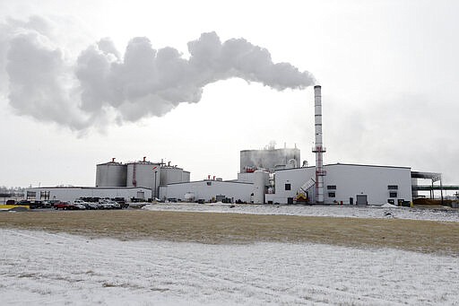 FILE - In this Jan. 6, 2015 file photo steam blows over the Green Plains ethanol plant in Shenandoah, Iowa. As hospitals and nursing homes run out of hand sanitizer to fight off the coronavirus, struggling ethanol producers are eager to help. They could provide alcohol to make millions of gallons of the germ-killing sanitizer, but the U.S. Food and Drug Administration has put up a roadblock, frustrating both the health care and ethanol industries with its inflexible regulations during a national health care crisis. (AP Photo/Nati Harnik, file)