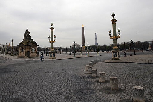 FILE - In this March 17, 2020 file photo, the deserted Place de la Concorde after nationwide confinement measures came into effect, in Paris. The confinement measures in and around Paris have had an impact in reducing the French capital's noise pollution levels. The new coronavirus causes mild or moderate symptoms for most people, but for some, especially older adults and people with existing health problems, it can cause more severe illness or death. (AP Photo/Francois Mori, File)