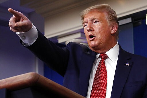 President Donald Trump takes questions from reporters during a briefing about the coronavirus in the James Brady Briefing Room, Wednesday, March 25, 2020, in Washington. (AP Photo/Alex Brandon)