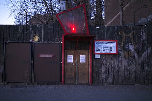 This March 25, 2020, photo, shows an entrance to the closed music club Wilde Renate in Berlin, Germany. The nightclubs in the German capital have decided to keep the beat going &#151; at least online. Berlin's nightclubs were closed on March 13 in an attempt to slow the spread of the coronavirus. In response, some clubs formed a streaming platform to let DJs, musicians and artists continue to perform.  (AP Photo/Markus Schreiber)