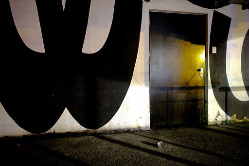 In this March 21, 2020, photo, an entrance door of music club Watergate is closed in Berlin, Germany. The nightclubs in the German capital have decided to keep the beat going &#151; at least online. The first livestream of the &#147;United We Stream&#148; project took place last week from the stage of Watergate, a nightclub housed in a former office building. (AP Photo/Markus Schreiber)