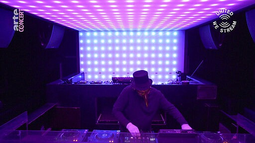 In this March 18, 2020, frame from video provided by Rundfunk Berlin-Brandenburg, DJ Claptone performs a set as part of the &quot;United We Stream&quot; event at the club Watergate in Berlin. Berlin's nightclubs were closed March 13 to help slow the spread of the virus. In response, some of them formed a streaming platform to let DJs, musicians and artists continue performing. (Rundfunk Berlin-Brandenburg via AP)