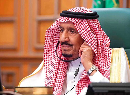 In this photo released by Saudi Press Agency, SPA, Saudi King Salman, chairs a video call of world leaders from the Group of 20 and other international bodies and organizations, from his office in Riyadh, Saudi Arabia, Thursday, March 26, 2020. The online meeting, that lasted about 90 minutes, aimed at coordinating the global response to the fast-spreading coronavirus, which has shuttered businesses and forced well over a quarter of the world's population into home isolation. (Saudi Press Agency via AP)