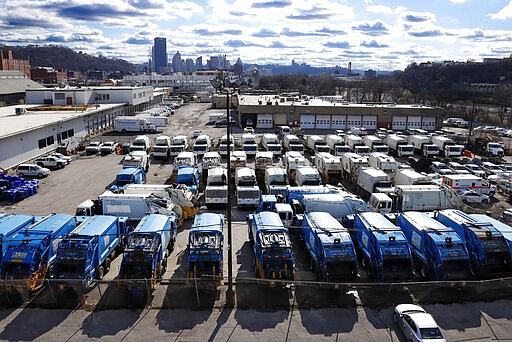 City of Pittsburgh sanitation trucks sit idle Wednesday, March 25, 2020 outside the Environmental Services buildings in Pittsburgh. Wednesday morning sanitation workers refused to collect the regularly scheduled trash pickup, expressing concerns that there were not enough safety measures in place to protect workers from potential exposure to COVID-19. The workers demanded protective equipment and hazard pay. The city anticipates normal garbage pickup to resume on Thursday. (AP Photo/Gene J. Puskar)