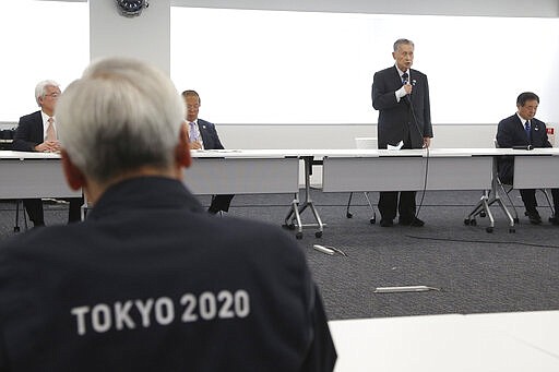 Tokyo 2020 Organizing Committee President Yoshiro Mori, center at rear, speaks during the first meeting of the &#147;Tokyo 2020 New Launch Task Force&quot; in Tokyo, Thursday, March 26, 2020, two days after the unprecedented postponement was announced due to the spreading coronavirus. The new Tokyo Olympics need dates for the opening and closing ceremony in 2021. Nothing moves until this is worked out by the International Olympic Committee, the Japanese government, and Tokyo organizers. (AP Photo/Koji Sasahara)