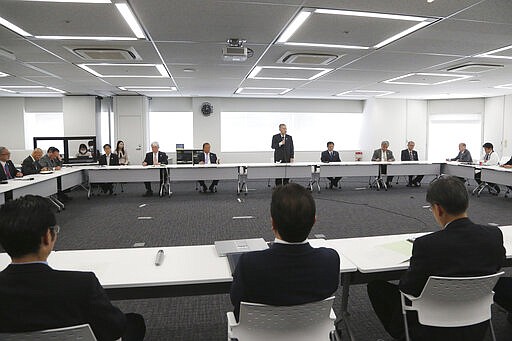 Tokyo 2020 Organizing Committee President Yoshiro Mori, center at rear, speaks during the first meeting of the &#147;Tokyo 2020 New Launch Task Force&quot; in Tokyo, Thursday, March 26, 2020, two days after the unprecedented postponement was announced due to the spreading coronavirus. The new Tokyo Olympics need dates for the opening and closing ceremony in 2021. Nothing moves until this is worked out by the International Olympic Committee, the Japanese government, and Tokyo organizers.(AP Photo/Koji Sasahara)