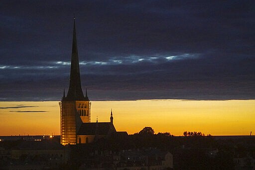 Dusk falls over Estonia's medieval capital, Tallinn, Thursday, June 27, 2019. The small Baltic nation spent more than a decade fighting fentanyl drug abuse. Although police won the war on fentanyl the market shifted further to synthetic drugs. (AP Photo/David Keyton)