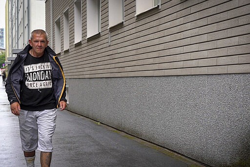 Igor Smirnov leaves a drug rehabilitation center in Tallinn, Estonia on Thursday, June 27, 2019. Smirnov was introduced to opiates the day his son was born, later migrating to a new drug that appeared on the quaint, cobbled streets of the country's capital, Tallinn: Fentanyl. (AP Photo/David Keyton)