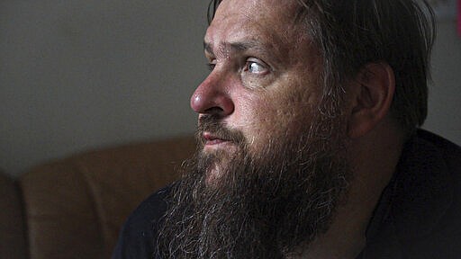 Former drug-user turned councillor Jaan Vaart, sits inside the staff room at the Convictus drug rehabilitation center in Tallinn, Estonia on Thursday, June 27, 2019. After Fentanyl, &quot;Heroin was like injecting water,&quot; he said. (AP Photo/David Keyton)