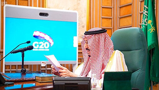 In this photo released by Saudi Press Agency, SPA, Saudi King Salman, chairs a video call of world leaders from the Group of 20 and other international bodies and organizations, from his office in Riyadh, Saudi Arabia, Thursday, March 26, 2020. The meeting is aimed at coordinating the global response to the fast-spreading coronavirus, which has shuttered businesses and forced well over a quarter of the world's population into home isolation. (Saudi Press Agency via AP)