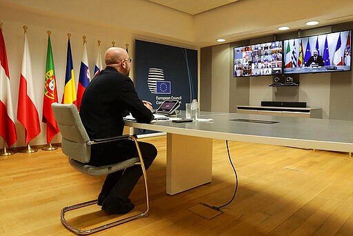 The President of the European Council Charles Michel participates in a video call of world leaders from the Group of 20 and other international bodies and organizations, Thursday, March 26, 2020. The meeting, which lasted about 90 minutes, was chaired by Saudi Arabia's King Salman, who is presiding over the G20 this year, the purpose was to tackle the pandemic and its economic implications as people lose their incomes amid closures, curfews and lockdowns. (Charles Michel European Council Twitter Page via AP)