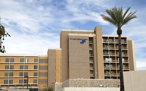 A group from the U.S. Army Corps of Engineers and the Arizona Health Department spent the day touring the currently closed St. Luke's Medical Center hospital to see the viability of reopening the facility for possible future use due to the coronavirus Wednesday, March 25, 2020, in Phoenix. (AP Photo/Ross D. Franklin)