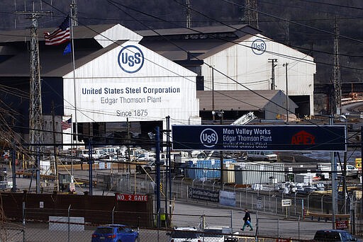 A worker leaves the U.S Steel Edgar Thomson Works in Braddock, Pa., Thursday, March 26, 2020. The plant was exempted from Pennsylvania Gov. Tom Wolf's order on Monday for &quot;non-life sustaining&quot; businesses to close. (AP Photo/Gene J. Puskar)