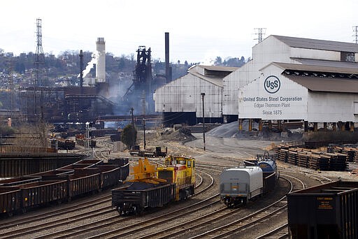 A locomotive works the yard at the U.S Steel Edgar Thomson Works in Braddock, Pa., Thursday, March 26, 2020. The plant was exempted from Pennsylvania Gov. Tom Wolf's order on Monday for &quot;non-life sustaining&quot; businesses to close. (AP Photo/Gene J. Puskar)