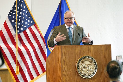 Minnesota Gov. Tim Walz addresses the media during news conference, Wednesday, March 18, 2020, in St. Paul, Minn., where he gave an update on the state's effort to slow down the coronavirus. (AP Photo/Jim Mone)