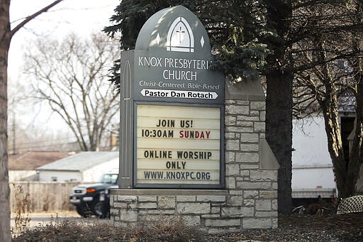 A church in south Minneapolis advises parishioners that the Sunday service would be online only Friday, March 27, 2020. Minnesota Gov. Tim Walz issued a stay-at-home order effective at midnight Friday to help stop the spread of the coronavirus in the state. Outdoor activities such as walking are permitted. The new coronavirus causes mild or moderate symptoms for most people, but for some, especially older adults and people with existing health problems, it can cause more severe illness or death. (AP Photo/Jim Mone)