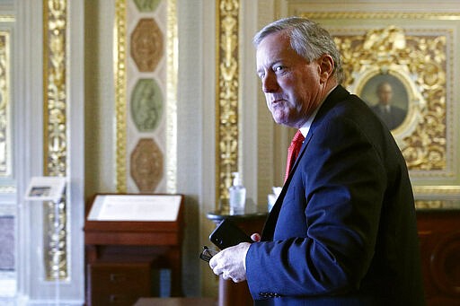 Acting White House chief of staff Mark Meadows walks on Capitol Hill in Washington, Tuesday, March 24, 2020, as the Senate works to pass a coronavirus relief bill. (AP Photo/Patrick Semansky)