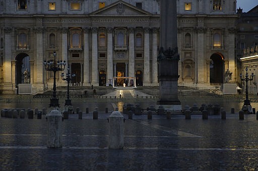 Pope Francis, small white figure at center, delivers the Urbi and Orbi prayer (Latin for To the City and To the World) in an empty St. Peter's Square, at the Vatican, Friday, March 27, 2020. Praying in a desolately empty St. Peter's Square, Pope Francis on Friday likened the coronavirus pandemic to a storm laying bare illusions that people can be self-sufficient and instead finds &quot;all of us fragile and disoriented&quot; and needing each other's help and comfort. The new coronavirus causes mild or moderate symptoms for most people, but for some, especially older adults and people with existing health problems, it can cause more severe illness or death. (AP Photo/Alessandra Tarantino)