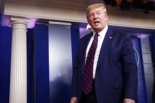 President Donald Trump leaves after speaking about the coronavirus in the James Brady Press Briefing Room, Friday, March 27, 2020, in Washington. (AP Photo/Alex Brandon)