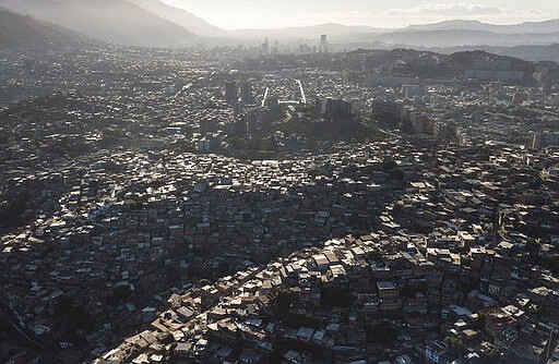 In this March 20, 2020 photo, cinderblock homes fill the hills of the Catia neighborhood in Caracas, Venezuela, as a government imposed quarantine to help stop the spread of the new coronavirus is in place. As the virus spreads, the World Health Organization has pointed out that the future of the pandemic will be determined by what happens in some of the world&#146;s poorest and most densely populated countries. From Mumbai to Rio de Janeiro to Johannesburg the question is: What do you do if there is no space to socially distance yourself from others in some of world&#146;s most unequal regions? (AP Photo/Matias Delacroix)