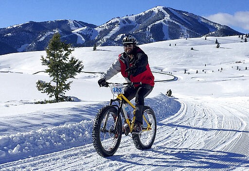 FILE - In this Jan. 30, 2016, file photo, a contestant competes in the Snowball Special fat bike race at Sun Valley Resort in Blaine County, Idaho. Three Idaho residents have become the first reported deaths in the state because of COVID-19, the illness caused by the coronavirus, state health officials announced Thursday.  Two of the cases were in Blaine County, the epicenter of Idaho's outbreak. (Chadd Cripe/Idaho Statesman via AP)