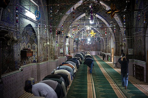 Few Pakistani worshippers attend a Friday prayers in Rawalpindi, Pakistan, Friday, March 27, 2020.  Authorities imposed nation-wide lockdown and appealed to people to avoid public gatherings as a preventive measure to contain the spread of coronavirus. The virus causes mild or moderate symptoms for most people, but for some, especially older adults and people with existing health problems, it can cause more severe illness or death.(AP Photo/B.K. Bangash)