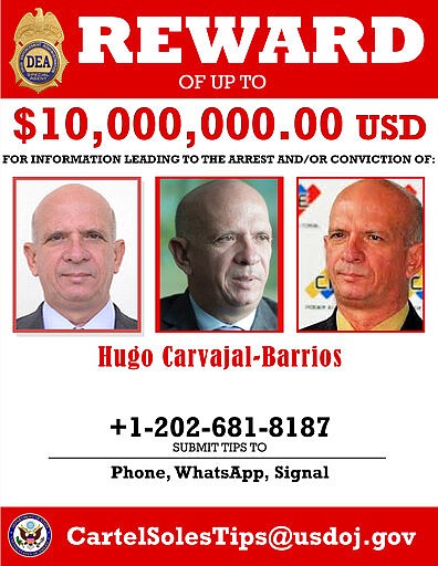 This image provided by the U.S. Department of Justice shows a reward poster for former Venezuelan military spy chief, retired Maj. Gen. Hugo Carvajal that was released on Thursday, March 26, 2020. The U.S. Justice Department has indicted Venezuela's socialist leader Nicol&aacute;s Maduro and several key aides on charges of narcoterrorism. (Department of Justice via AP)