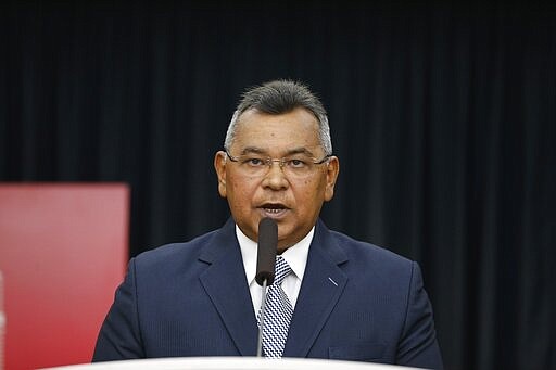 FILE - In this Sept. 13, 2019 file photo, Venezuelan Minister of Internal Affairs, Justice and Peace, Nestor Reverol, gives a press conference in Caracas, Venezuela. On Thursday, March 26, 2020, the U.S. Justice Department made public it has charged in several indictments against Venezuelan President Maduro and his inner circle, including Reverol, that the leader has effectively converted Venezuela into a criminal enterprise at the service of drug traffickers and terrorist groups as he and his allies stole billions from the South American country.  (AP Photo/Leonardo Fernandez, File)