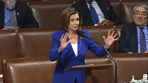 In this image from video, House Speaker Nancy Pelosi of Calif., speaks on the floor of the House of Representatives at the U.S. Capitol in Washington, Friday, March 27, 2020. (House Television via AP)